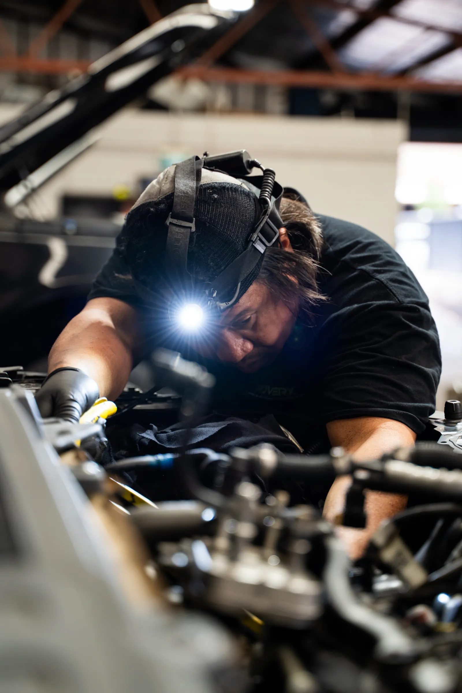 RoverX technician repairing a Land Rover engine in the Kirrawee workshop