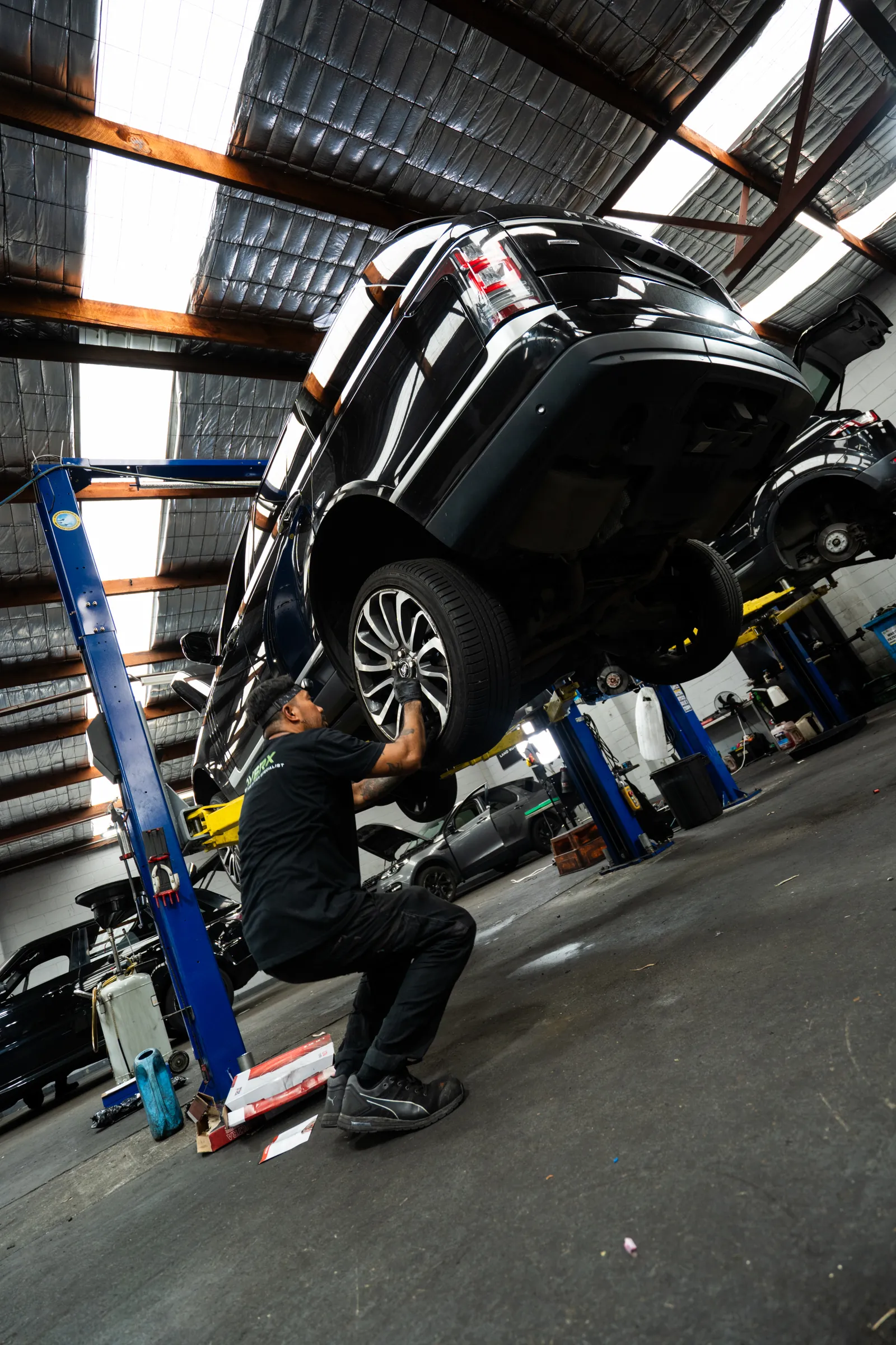 Land Rover and Range Rover vehicles in the RoverX workshop