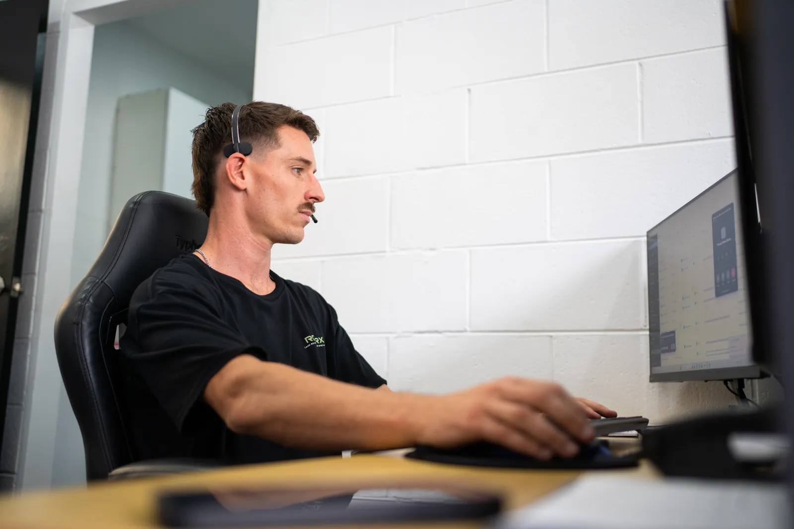 RoverX technician reviewing engine management data on the workshop computer